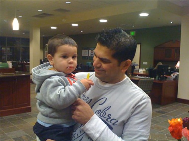 Solomon Metalwala, right, is seen holding his son Sky Metalwala, in this undated photo. Police in Washington state spent a second day on Nov. 7,  searching for the toddler whose mother said he vanished from an unlocked car that ran out of gas. Bellevue police Maj. Mike Johnson said Wednesday afternoon there was enough gas in the car to run a considerable distance. 